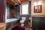 Master bath has a large soaking tub which is great for after skiing and hiking